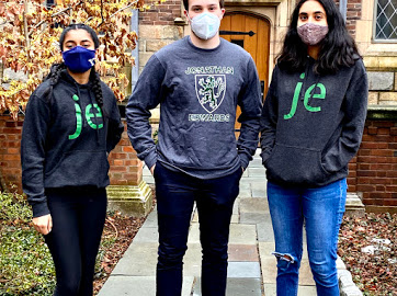 3 students wearing the JE Hoodies and the JE Crest Crewneck